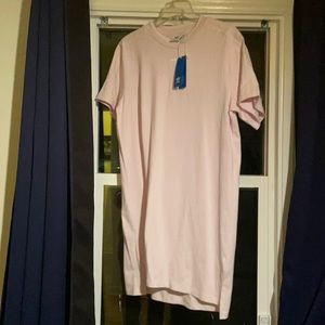 Adidas tennis tee. Subtle three stripe styling on the sleeve.